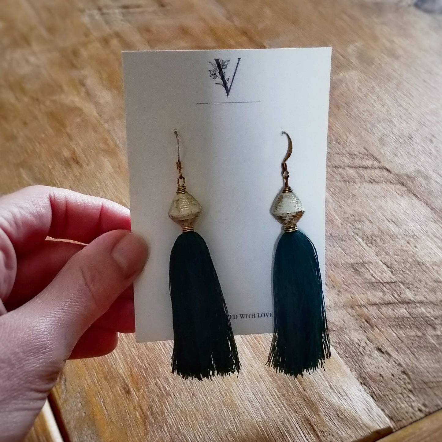 Golden Tassel Earrings Empowering Women in Uganda - emerald in packaging