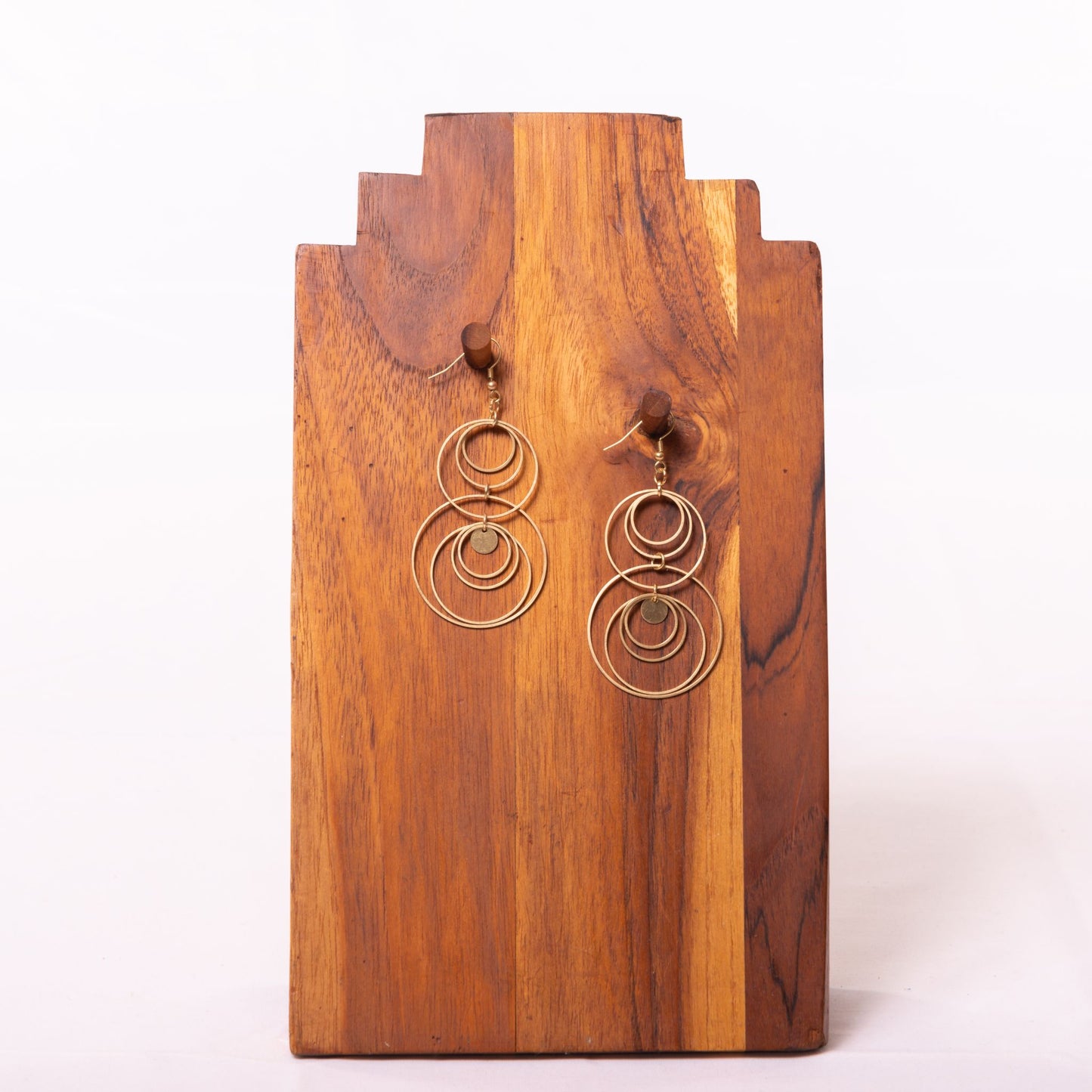 NEW! Duara Brass Circle Earrings Handmade and Fair Trade - against wooden background