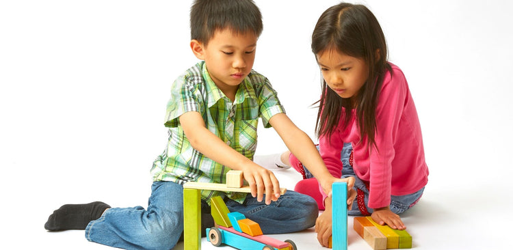 Gifts and Toys for 8 Year Olds - children playing with wooden building blocks