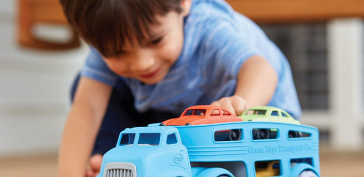 Gifts and Toys for 3 Year Olds - child playing with car carrier toy