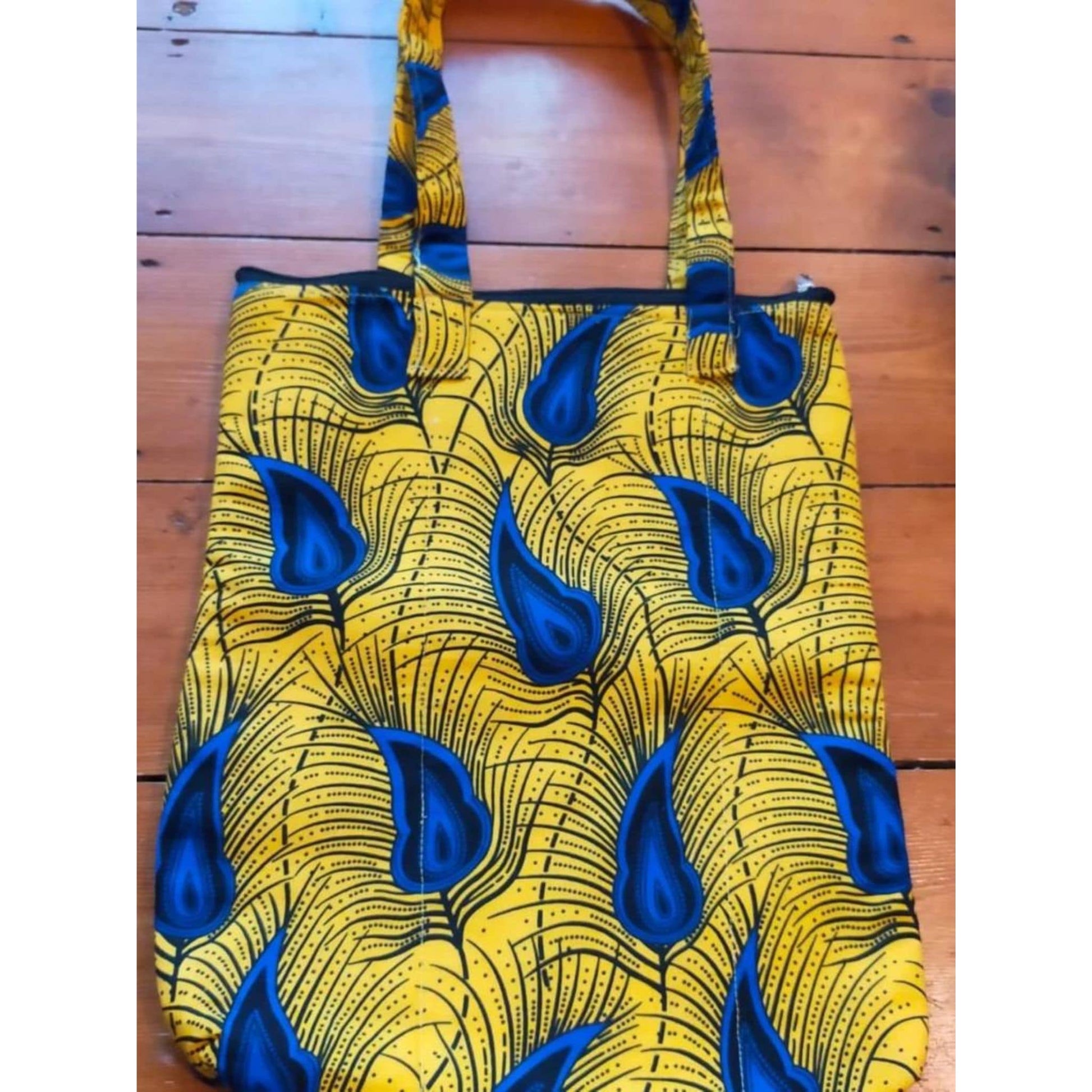 Colourful Tote Bag Changing Lives - blue and yellow feather