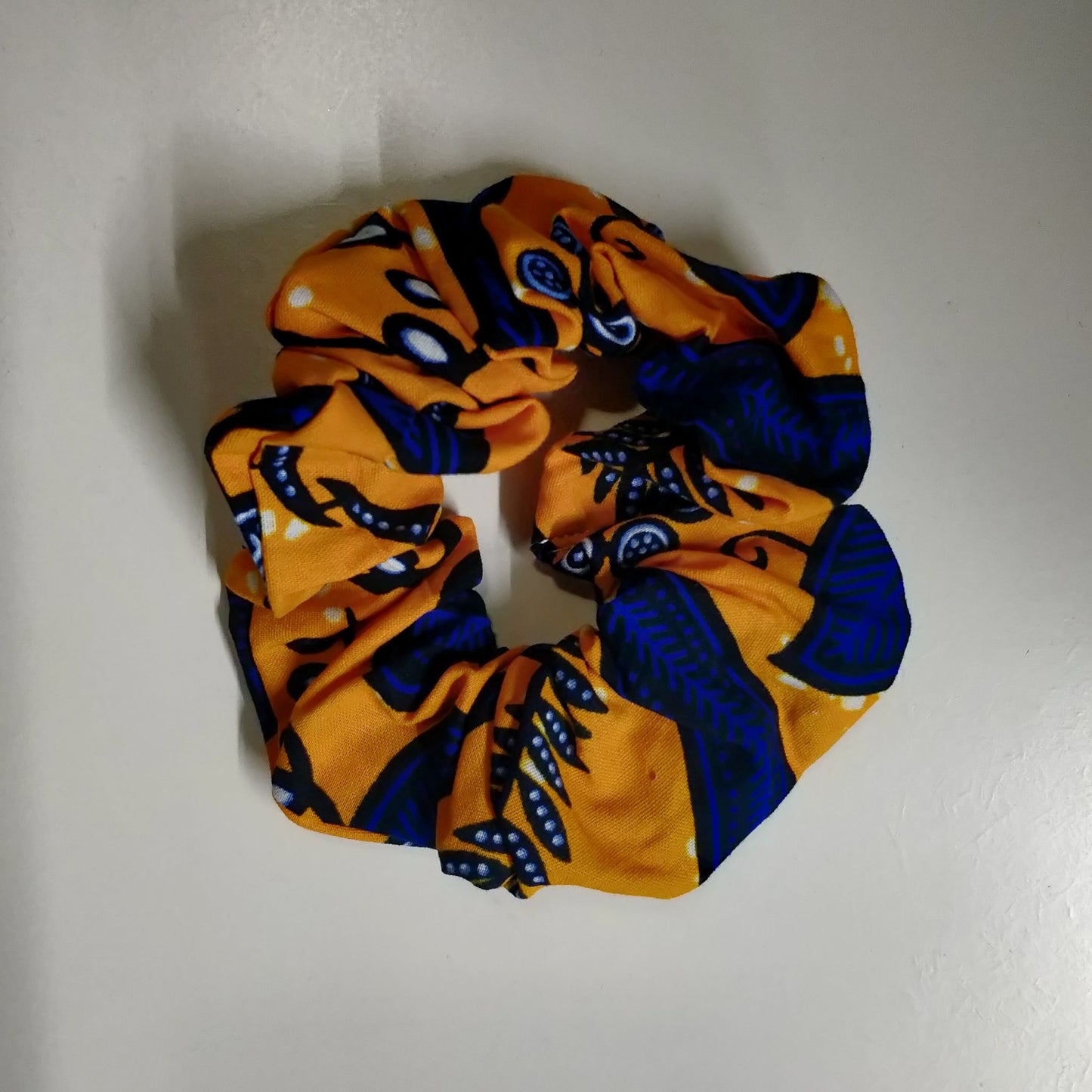 Colourful Scrunchies Changing Lives  Ethical Cotton - orange and navy leaf