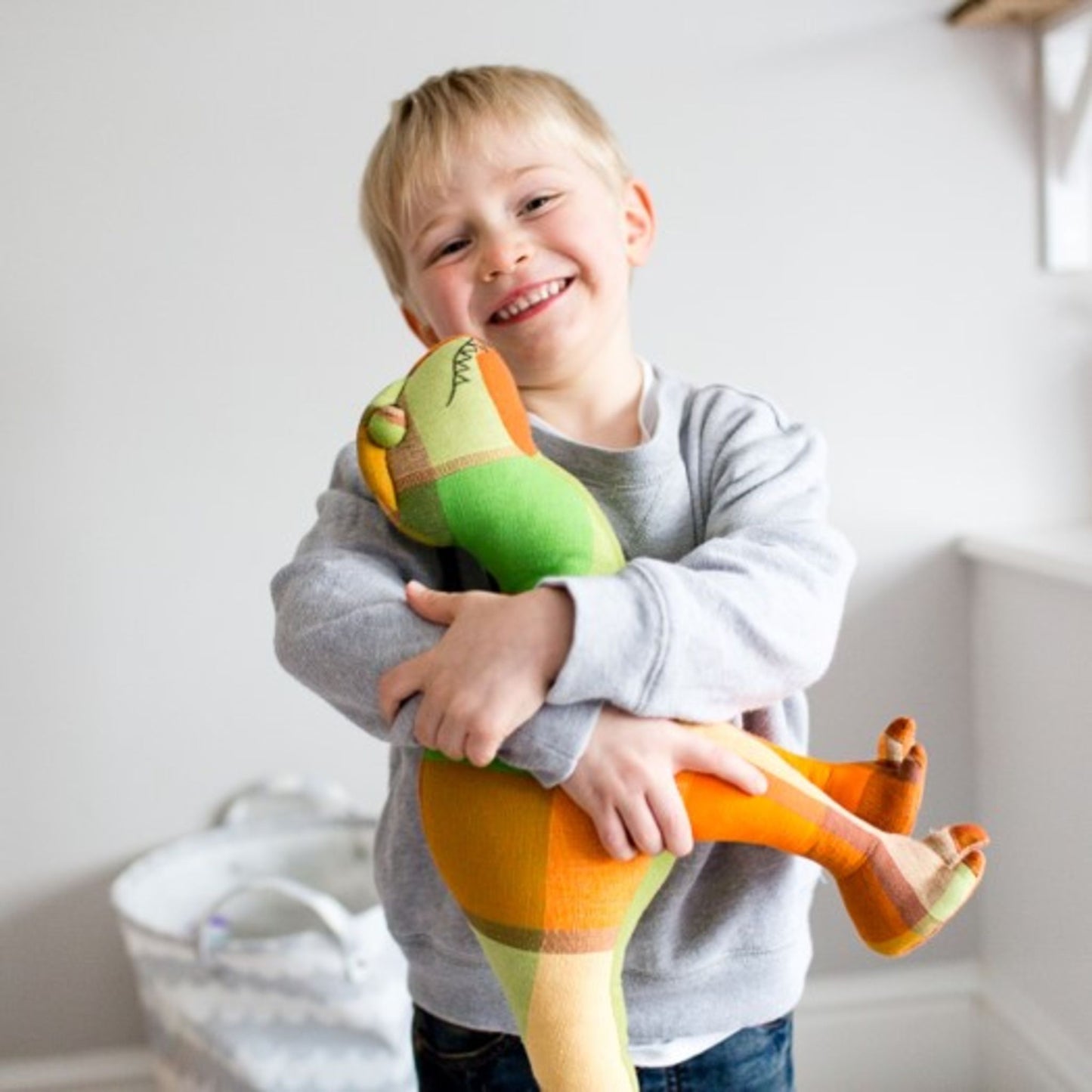 Dinosaur soft toy | Fair Trade toys - cotton toy held by child