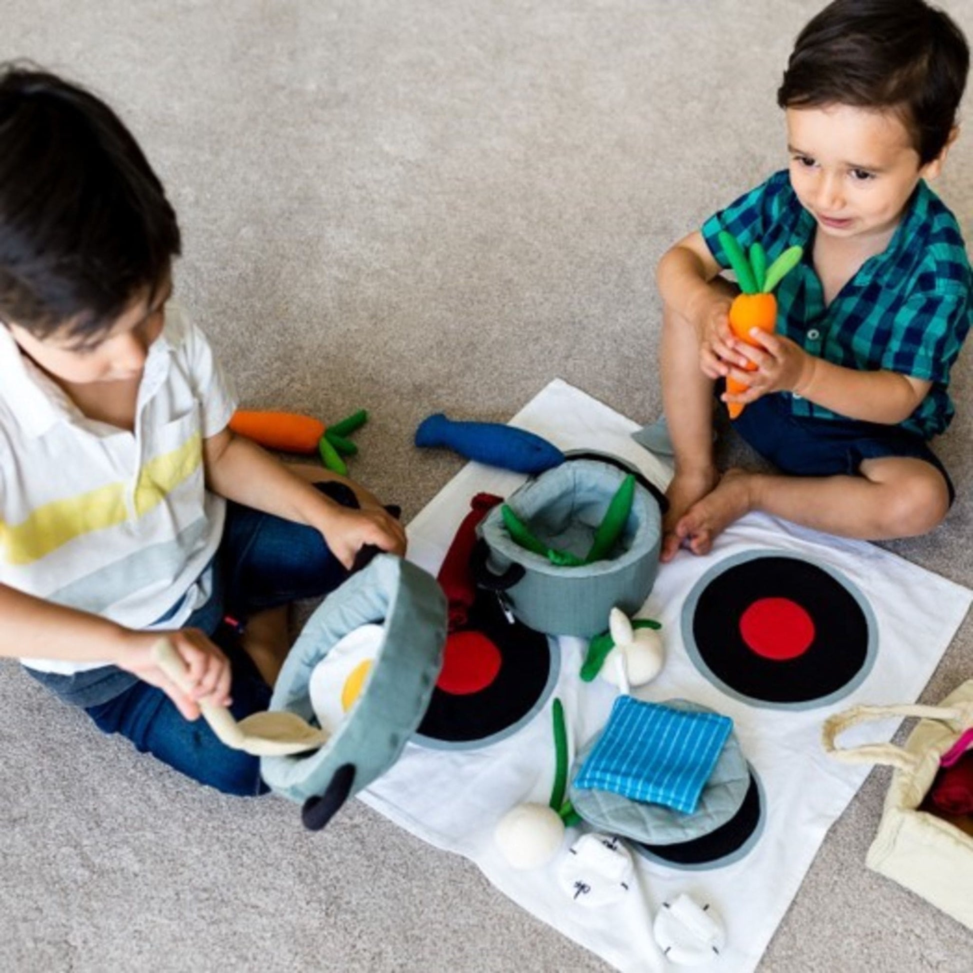 Fair Trade cotton cooking play set from Weaving Hope toys on floor