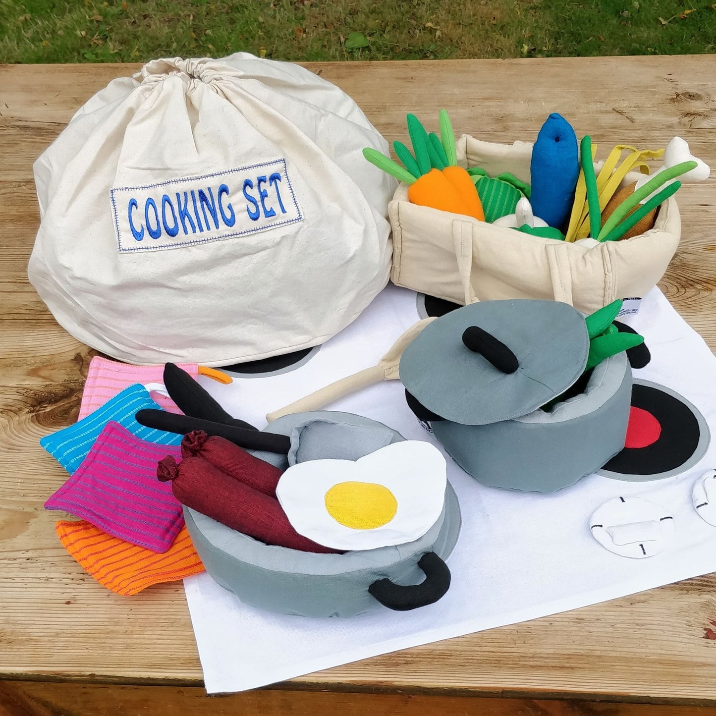 Fair Trade + handmade cotton cooking set on wooden table