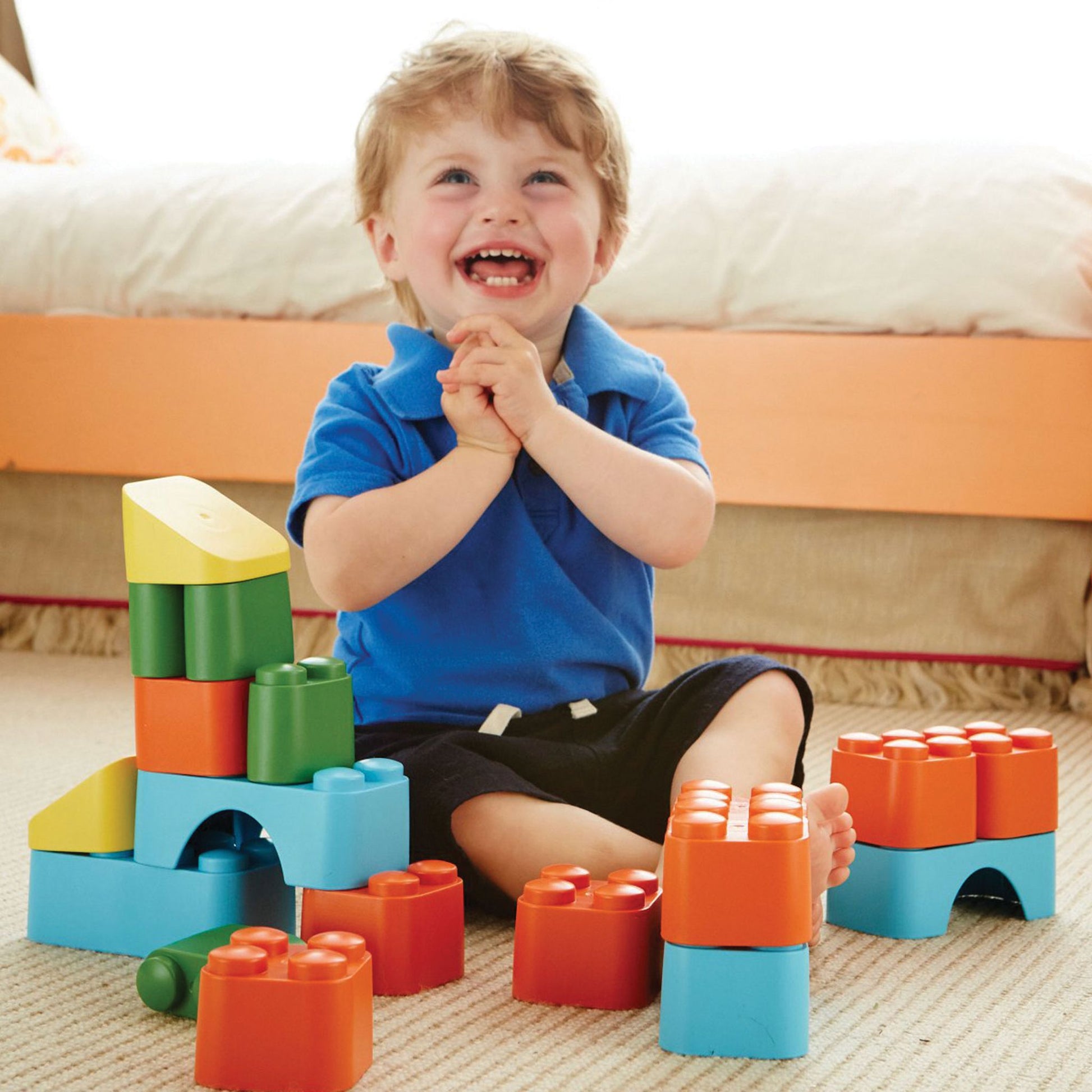 Green Toys Recycled Plastic Blocks - child playing with stacking blocks