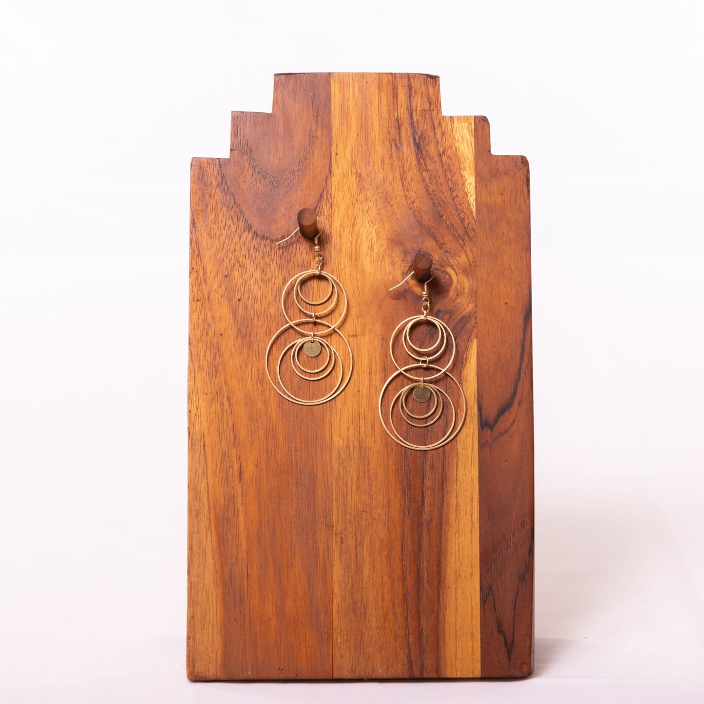 NEW! Duara Brass Circle Earrings  Handmade and Fair Trade - against wooden background
