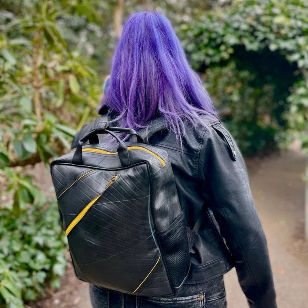 Portobello Backpack made from Recycled Materials - yellow being worn