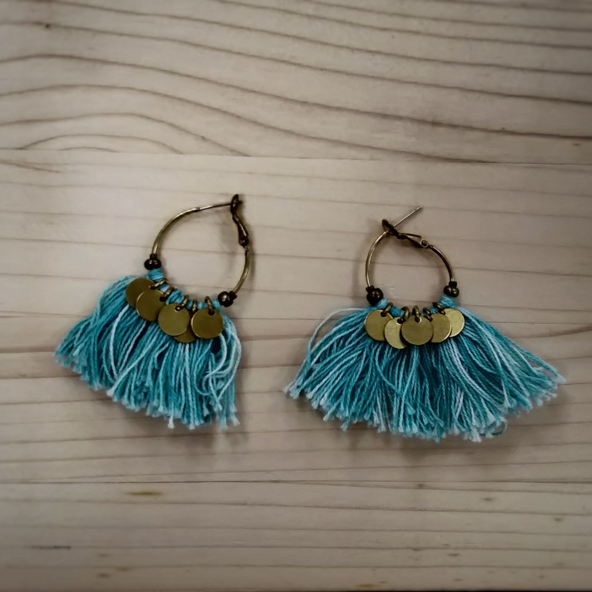 Tassel Earrings  Handmade and Fair Trade - blue tassel earrings against wooden background