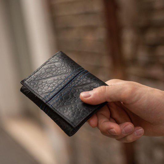 Trifold Recycled Wallet made from Inner Tubes - hand holding wallet